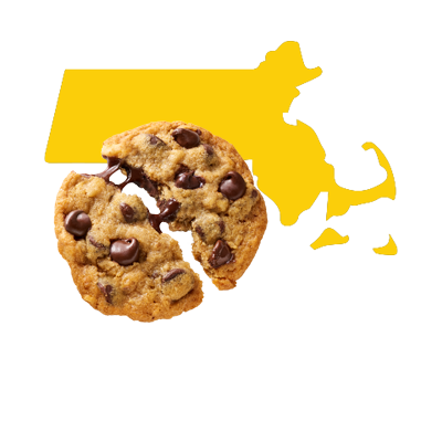 A yellow vector illustration of Massachusetts sits behind a broken and melty chocolate chip cookie. A yellow vector illustration of Massachusetts sits behind a broken and melty chocolate chip cookie.