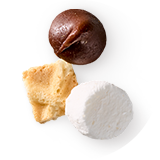 A piece of waffle cone, marshmallow and chocolate morsel.