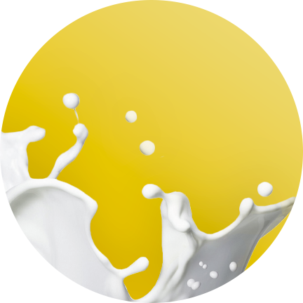 A splash of milk against a yellow circular background