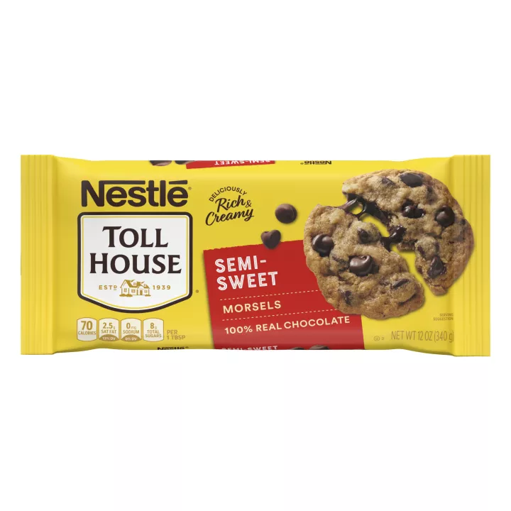 A yellow bag of semi-sweet morsels with a red label beside a gooey chocolate chip cookie and chocolate morsels.