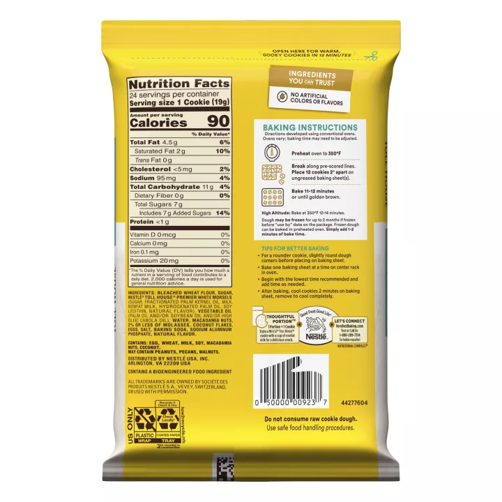 Left angle view of a yellow and white package featuring the NESTLÉ® TOLL HOUSE® logo with a teal label that reads "white chip macadamia nut cookie dough," with 2 white chip macadamia nut cookies on a white surface below.