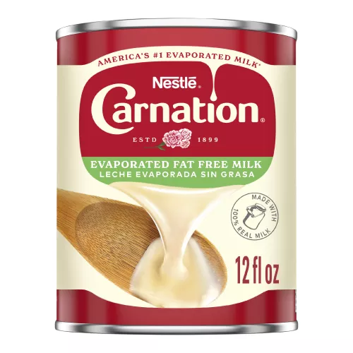 Front Center view of CARNATION Fat Free Evaporated Milk 12 fl. oz. Can NET 12 fl oz (354 mL) product.