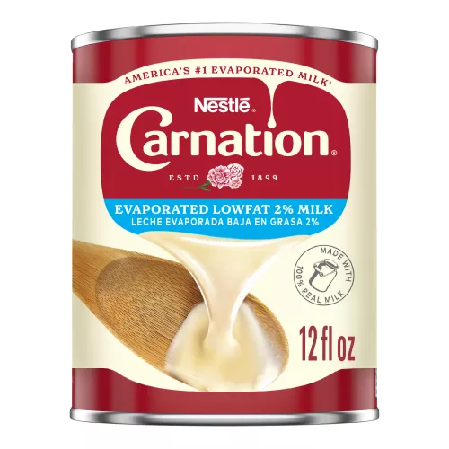Front Center view of CARNATION Evaporated Lowfat 2% Milk 12 fl. oz. Can NET 12 fl oz (354 mL) product.