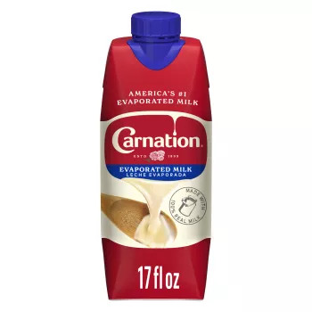 Front Center view of NESTLE CARNATION Evaporated Milk 17oz Tetra Carton NET / NETO 17 fl oz (1 pt 1 fl oz) 502 mL product.