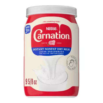 Front Center view of CARNATION Mlk Dry Non Fat Dry Milk 9.625 Ounce Can NET WT 9 5/8 oz (272 g) product.