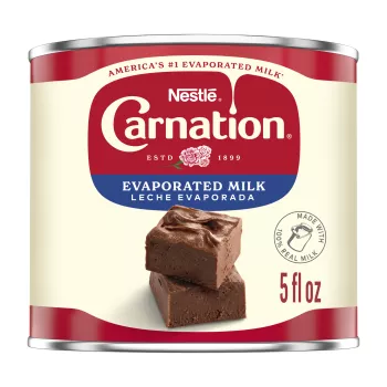 Front Center view of CARNATION Vitamin D Added Evaporated Milk 5 fl. oz. Can NET 5 FL OZ (147 mL) (bilingual) product.