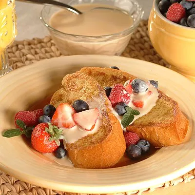 Dessert French Toast with Fresh Berries and Cinnamon Vanilla Sauce