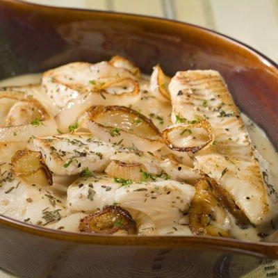 Fish Baked In Creamy Milk Sauce with Onions Herbs